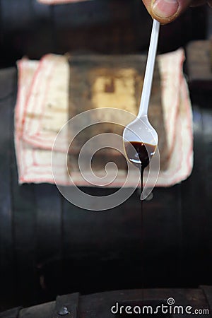 very old Balsamico dripping from a spoon Stock Photo