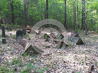 Very old cemetery in woods Stock Photo