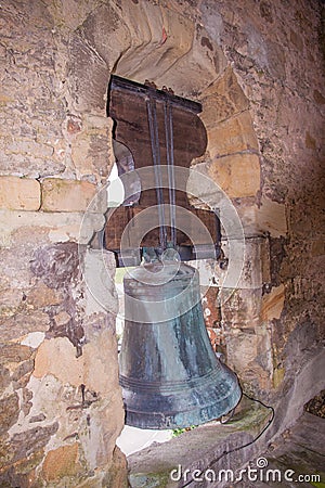 Old European church seen from the inside of the tower bell, in OmoÃ±o, Cantabria, Spain Stock Photo