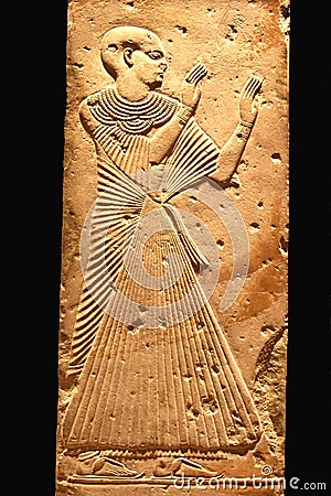 Upper class Egyptian woman at ancient hieroglyph, Luxor, Egypt Editorial Stock Photo