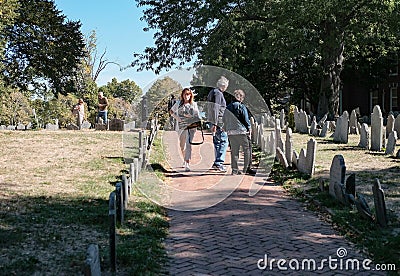 Members of the US public seen looking a old war graves in a Boston cemetery. Editorial Stock Photo