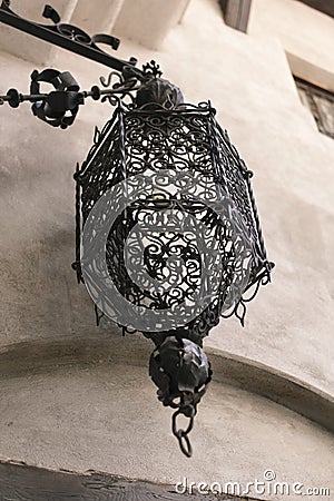 Very old medieval hammered lamp in the old city of Bran, Transyl Stock Photo