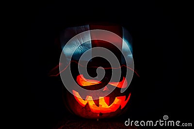 Very scary Halloween pumpkin, with a menacing glance and a grinn Stock Photo