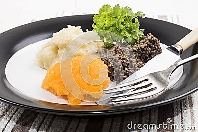 Very scottish meal, haggis, swede and mashed potato on a plate Stock Photo