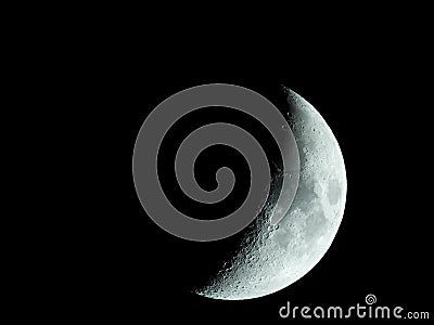 very sharp close-up of the rising crescent moon in the night sky Stock Photo