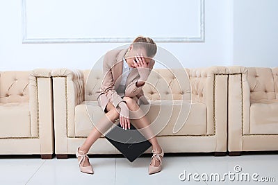 A very upset business woman covered her face with her hands. Negative emotion. Financial crisis.Copy of the space Stock Photo