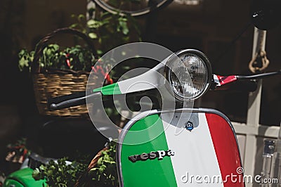 Vespa Piaggio motorcycle with a basket of chilies on display in Tropea, Calabria Editorial Stock Photo