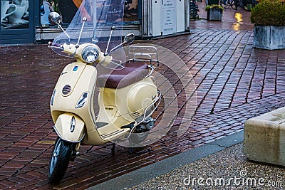 Vespa scooter parked in the city streets, popular urban transport, well known brand from italy, Alphen aan den rijn, 12 februari, Editorial Stock Photo