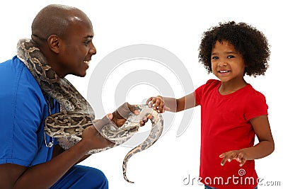 Vet and Preschool Child Snake Owner Helping Pet Stock Photo