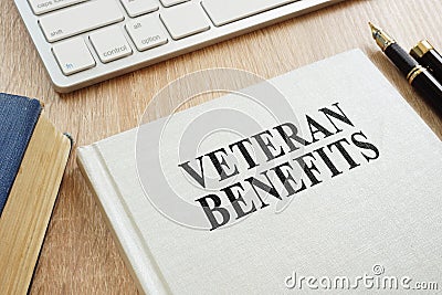 Veteran Benefits on a desk. Stock Photo