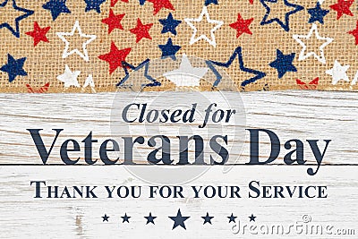 Veterans Day closed message with stars on a weathered whitewash wood Stock Photo