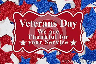 Veterans Day message with red, white and blue glitter stars Stock Photo