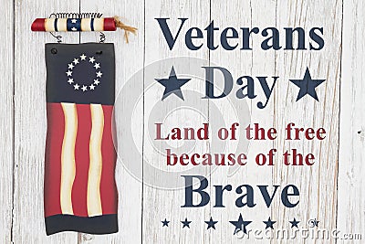 Veterans Day message with old wood flag on a weathered whitewash wood Stock Photo