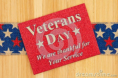 Veterans Day thank you type message on glitter red greeting card Stock Photo