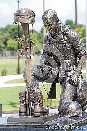 Veterans Memorial Soldier Helmet and Rifle Bronze Statue 3 Stock Photo