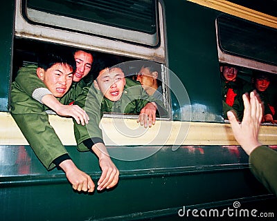 The veterans retired, sit on the train to say goodbye to the comrades, the soldiers wept with red flowers Editorial Stock Photo