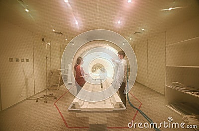 Veterinarian doctor working in MRI scanner room Editorial Stock Photo