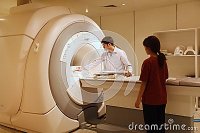 Veterinarian doctor working in MRI scanner room Editorial Stock Photo