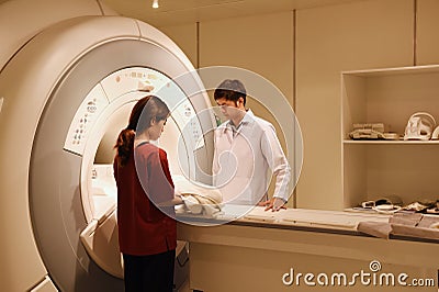 Veterinarian doctor working in MRI scanner room Editorial Stock Photo