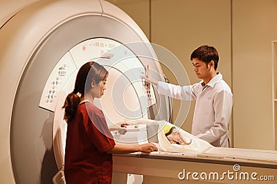 Veterinarian doctor working in MRI scanner room Editorial Stock Photo