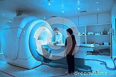 Veterinarian doctor working in MRI scanner room Editorial Stock Photo