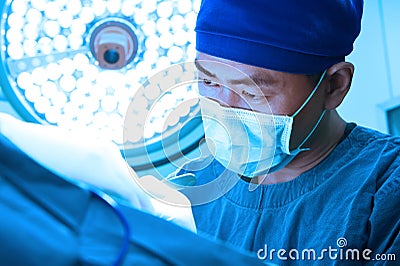 A veterinarian surgeons in operating room Editorial Stock Photo