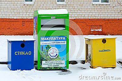 Multicolored containers for separate collection of garbage on city street Editorial Stock Photo