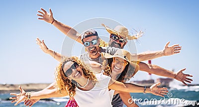 Group of happy adult friends enjoy and celebrate together the summer holiday vacation travel leisure acitivity - men and women Stock Photo