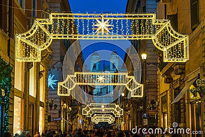 Via dei Condotti leading to Piazza di Spagna. Christmas time in Rome, Italy. Editorial Stock Photo