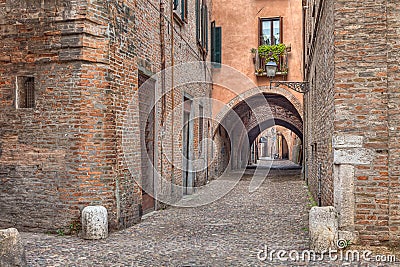 Via delle Volte, medieval alley in Ferrara, Italy Stock Photo