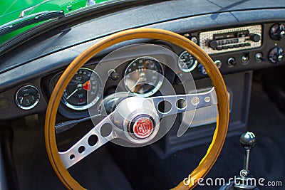 Vianden, Luxembourg; 08/12/2018: view of the steering wheel and speedometer in the interior of a MG MGB, a vintage old classic Editorial Stock Photo