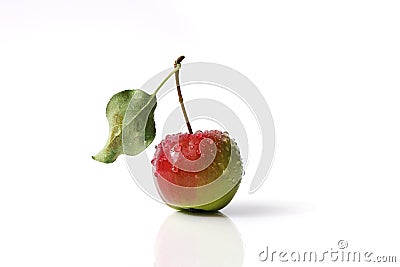 Vibrant crab apple with attached leaf isolated on a white background Stock Photo