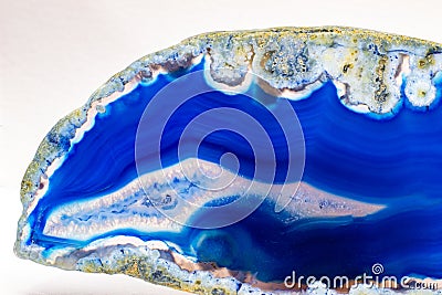 Vibrant deep blue and semi-transparent agate geode slice crystal Stock Photo