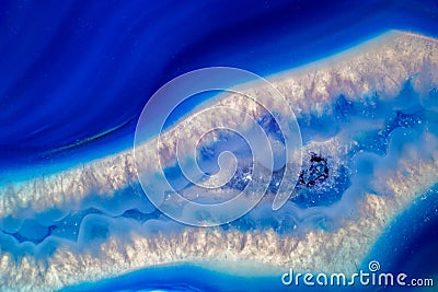 Vibrant deep blue and semi-transparent agate geode slice crystal Stock Photo