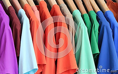 Vibrant Fashion Selection: Colorful T-Shirts Hanging on a Hanger, Showcasing Trendy and Versatile Clothing Options Stock Photo