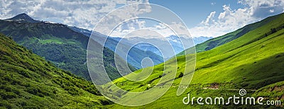 Vibrant mountain landscape. Green meadows on the high hills in Georgia, Svaneti region. Panoramic view on grassy highlands Stock Photo