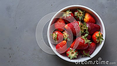 Vibrant Organic Strawberries White Dish on Muted Gray Background Stock Photo