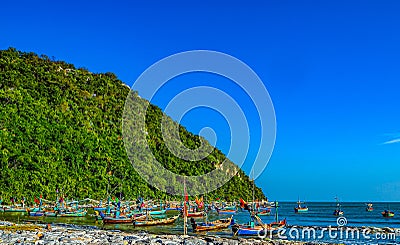 Vibrant Reflections: Traditional Fishing Boat at the Shores of Thailand Stock Photo