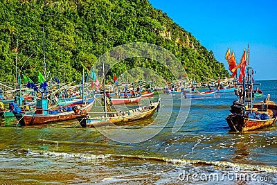 Vibrant Reflections: Traditional Fishing Boat at the Shores of Thailand Editorial Stock Photo