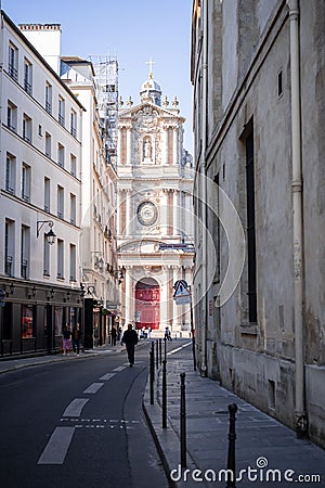 Exterior view of a traditional European street with people walking by Editorial Stock Photo