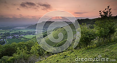 Vibrant sunrise over countryside landscape Stock Photo