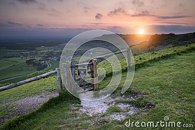 Vibrant sunrise over countryside landscape Stock Photo