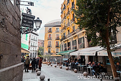 A vibrant weekend morning on the Calle Cava de San Miguel, Madrid, Spain Editorial Stock Photo