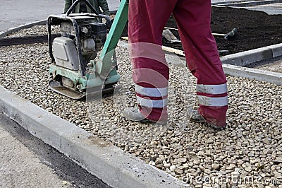 Vibrating machine for repairing asphalt Stock Photo