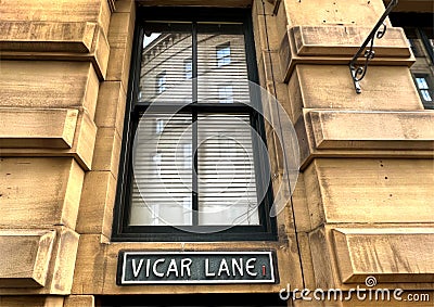 Vicar Lane street sign, affixed to Victorian Yorkshire Stone in, Little Germany, Bradford, UK Stock Photo