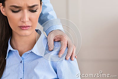 Businesswoman Victim Of Sexual Harassment Sitting In Office, Cropped Stock Photo