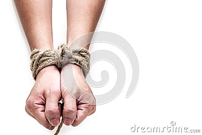 Victim, slave, prosoner male hands tied by big rope Stock Photo