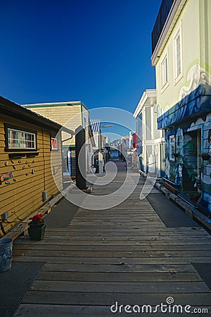 Victoria, British Columbia, Canada: The boardwalk at Fishermanâ€™s Wharf Editorial Stock Photo