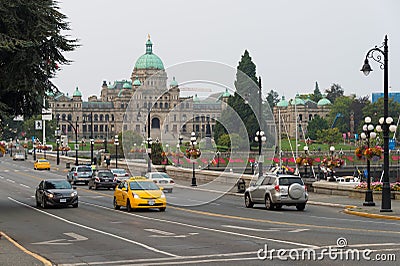 Morning traffic on Government street and British Columbia Legislature in Editorial Stock Photo