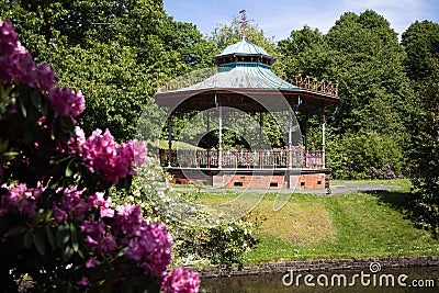 Victorian bandstand with flowers in springtime at Sefton park in Liverpool Stock Photo